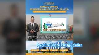 ดูเครื่องปูผิวทางแบบสลิปฟอร์ม SMP-1200 สำหรับการสาธิตการปูดาดฟ้าสะพาน